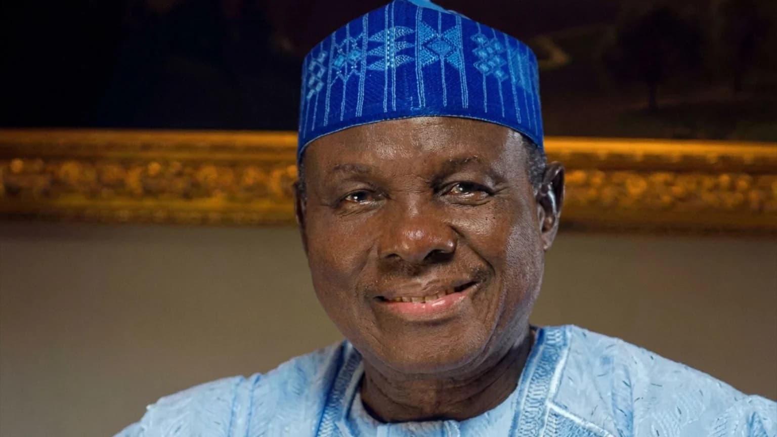 Former Nigerian federal minister Jerry Gana smiling in a traditional cap and attire