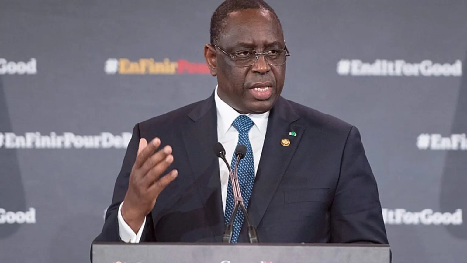 Former Senegalese President Macky Sall speaking at a podium